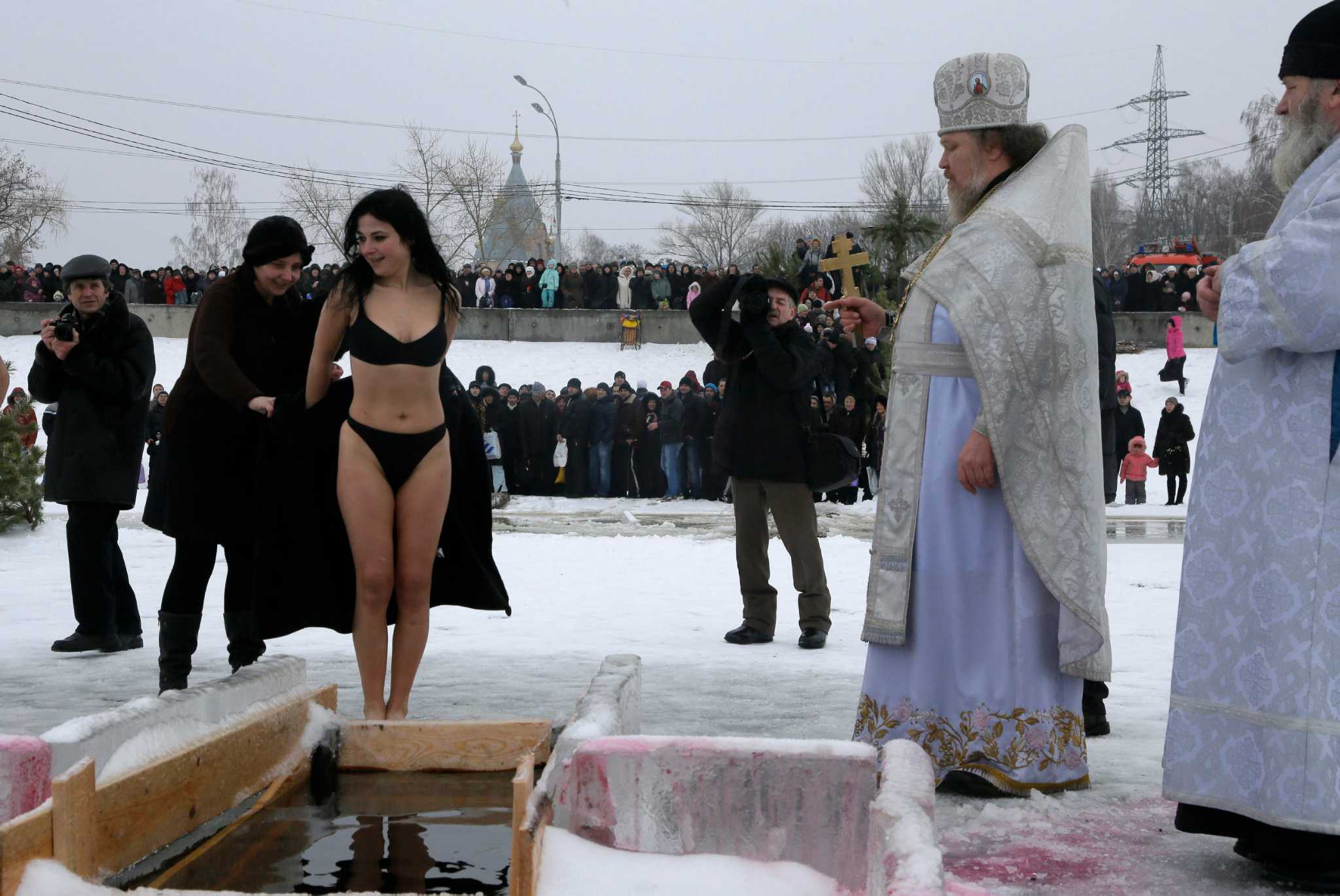Russian Woman Jumps Into Ice Hole